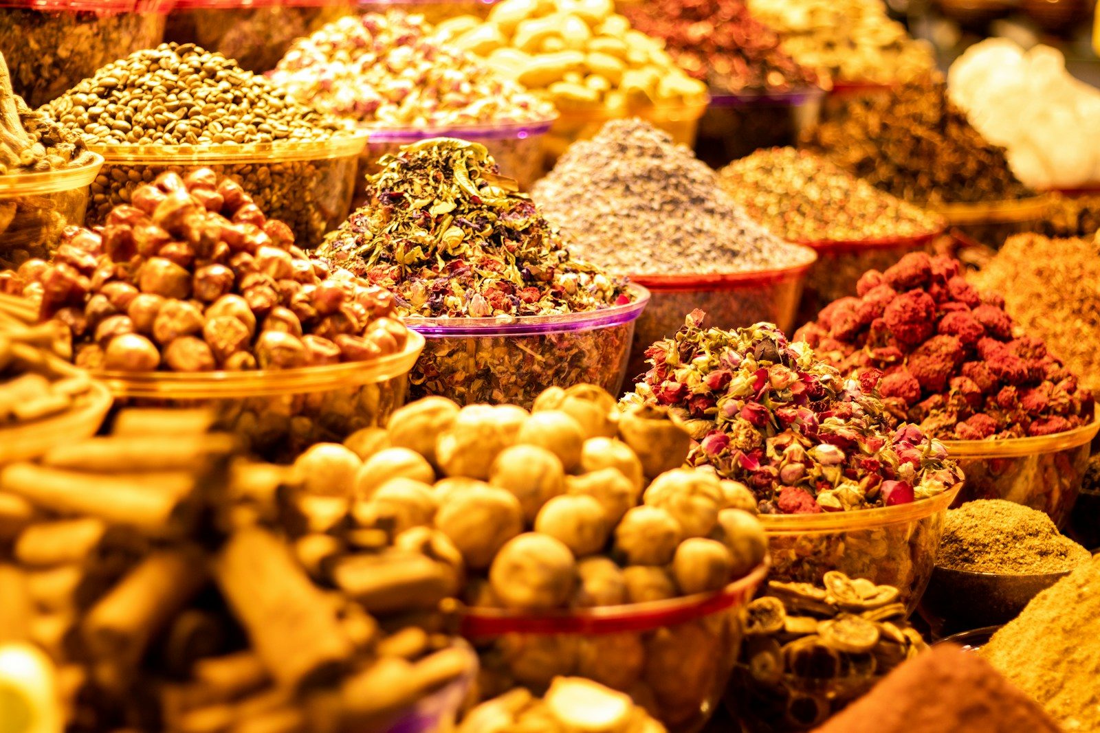 Photo by Arjun Radeesh a variety of spices are displayed in baskets